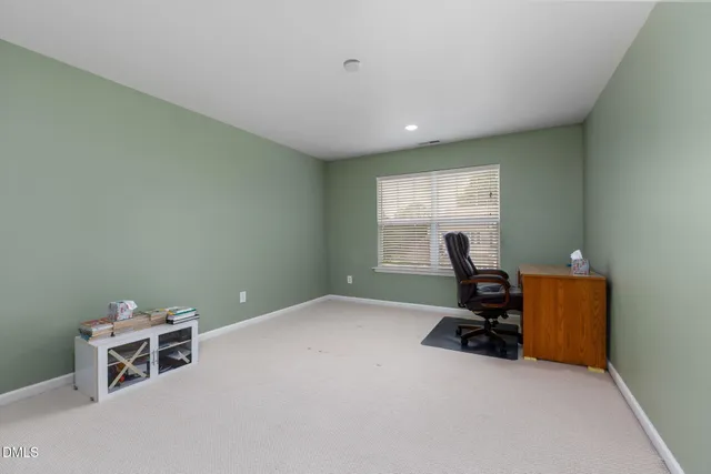 a workspace with furniture and a window