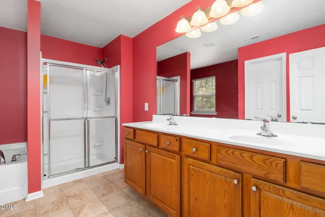 a bathroom with a sink vanity and a mirror