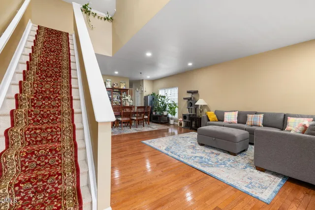 a living room with furniture and a rug
