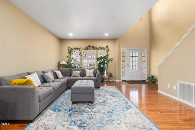 a living room with furniture and a rug