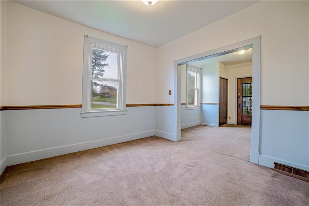 99 Kiskiminetas Drive Apollo, PA 15613 - Photo 11 of 24 an empty room with windows and chandelier fan