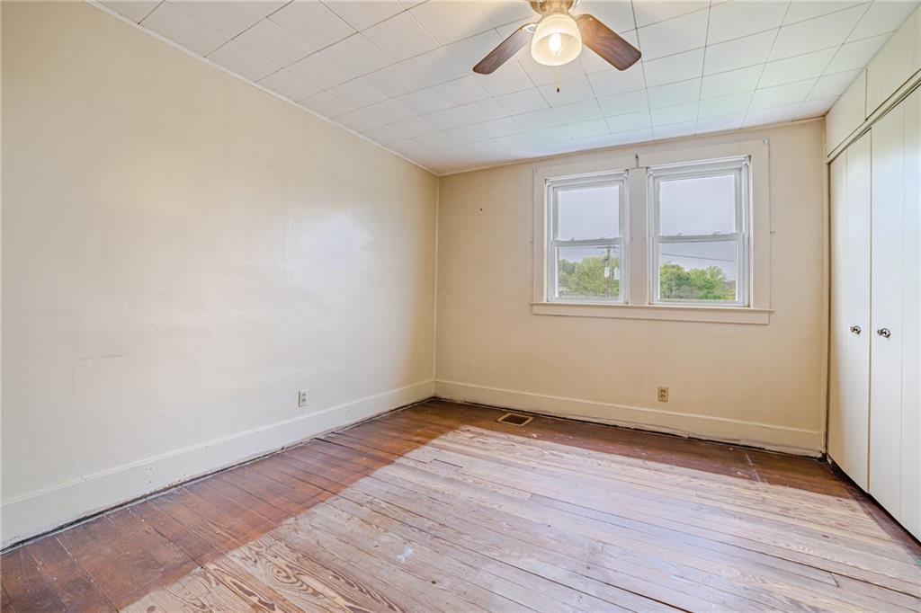 99 Kiskiminetas Drive Apollo, PA 15613 - Photo 19 of 24 an empty room with wooden floor and windows