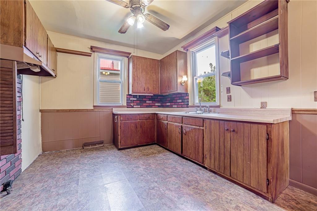 99 Kiskiminetas Drive Apollo, PA 15613 - Photo 4 of 24 a kitchen with stainless steel appliances granite countertop a stove a sink and a refrigerator