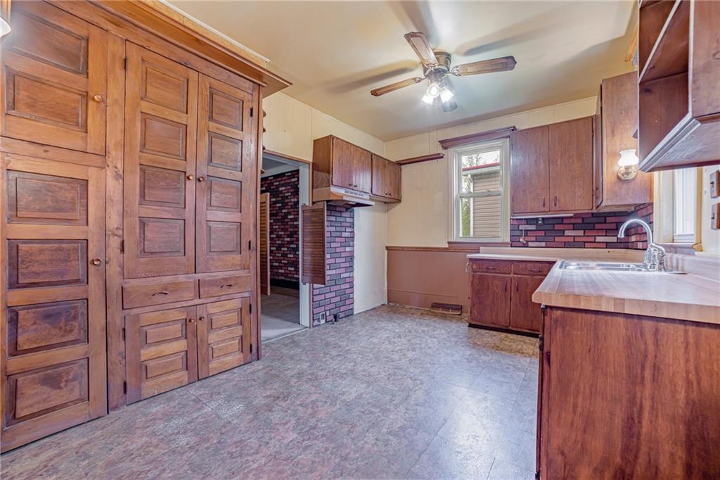 99 Kiskiminetas Drive Apollo, PA 15613 - Photo 5 of 24 a kitchen with granite countertop a sink cabinets stainless steel appliances and a window