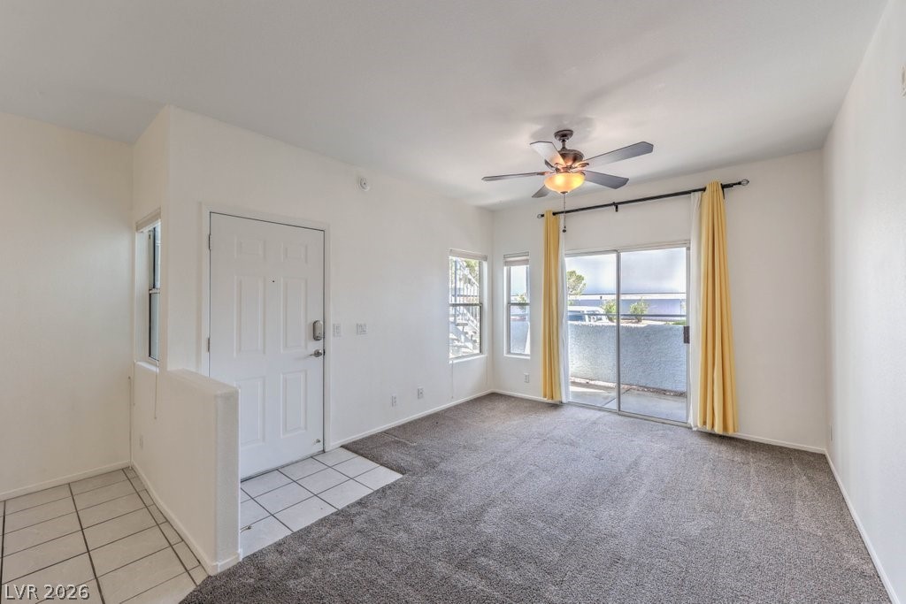 2201 Ramsgate Drive, Unit 1017 Henderson, NV 89074 - Photo 6 of 30 This bright living space features a sliding glass door leading to an outdoor patio.