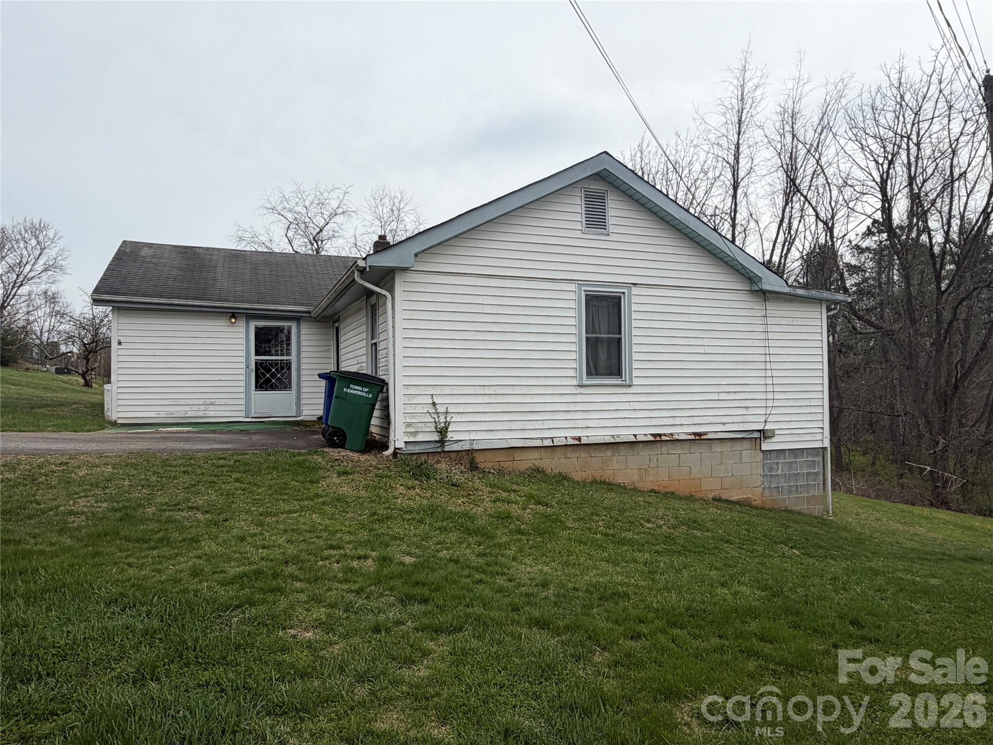 72 Alexander Road Weaverville, NC 28787 - Photo 3 of 17 a house view with a garden space