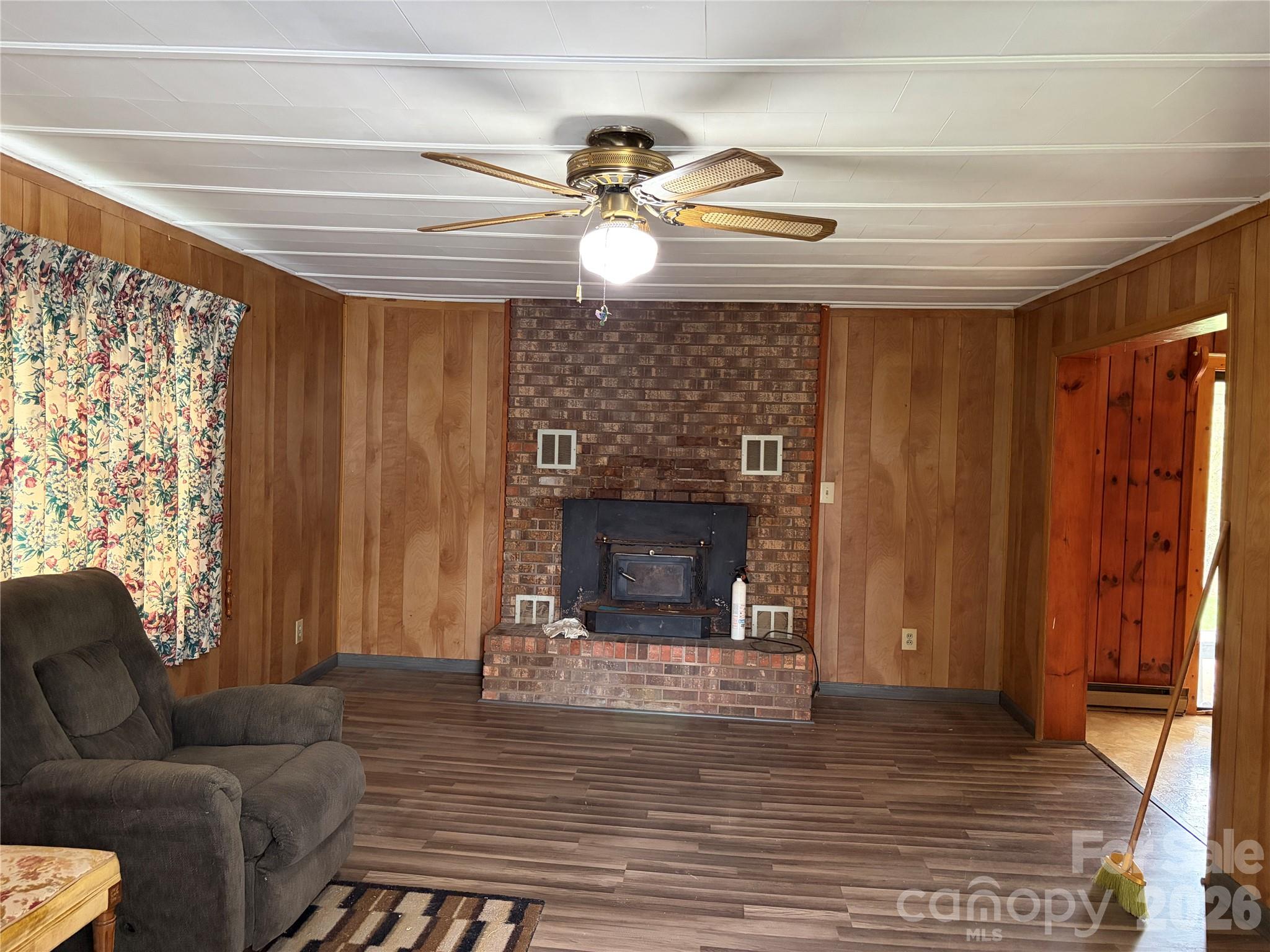 72 Alexander Road Weaverville, NC 28787 - Photo 6 of 17 a living room with furniture and a fireplace