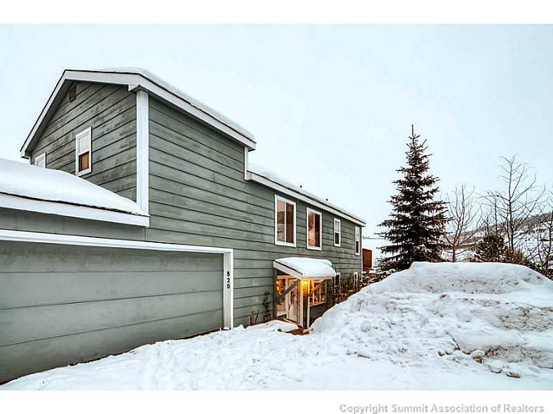 820 Alpine Road Dillon, CO 80435 - Photo 2 of 25 a side view of a house with a bench
