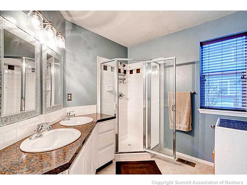 820 Alpine Road Dillon, CO 80435 - Photo 17 of 25 a bathroom with a sink double vanity and a mirror
