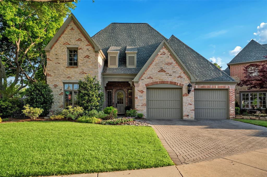 2100 Sutton Place Plano, TX 75093 - Photo 1 of 1 a front view of a house with a garden and plants