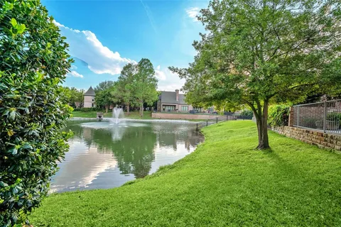 a view of a lake with a building in the background