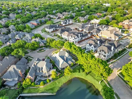 an aerial view of residential house with outdoor space and swimming pool