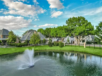 a view of a lake with a house in the background