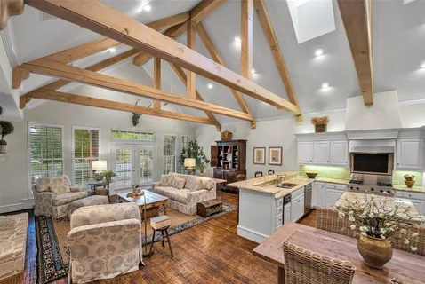 a living room with fireplace furniture and a fireplace