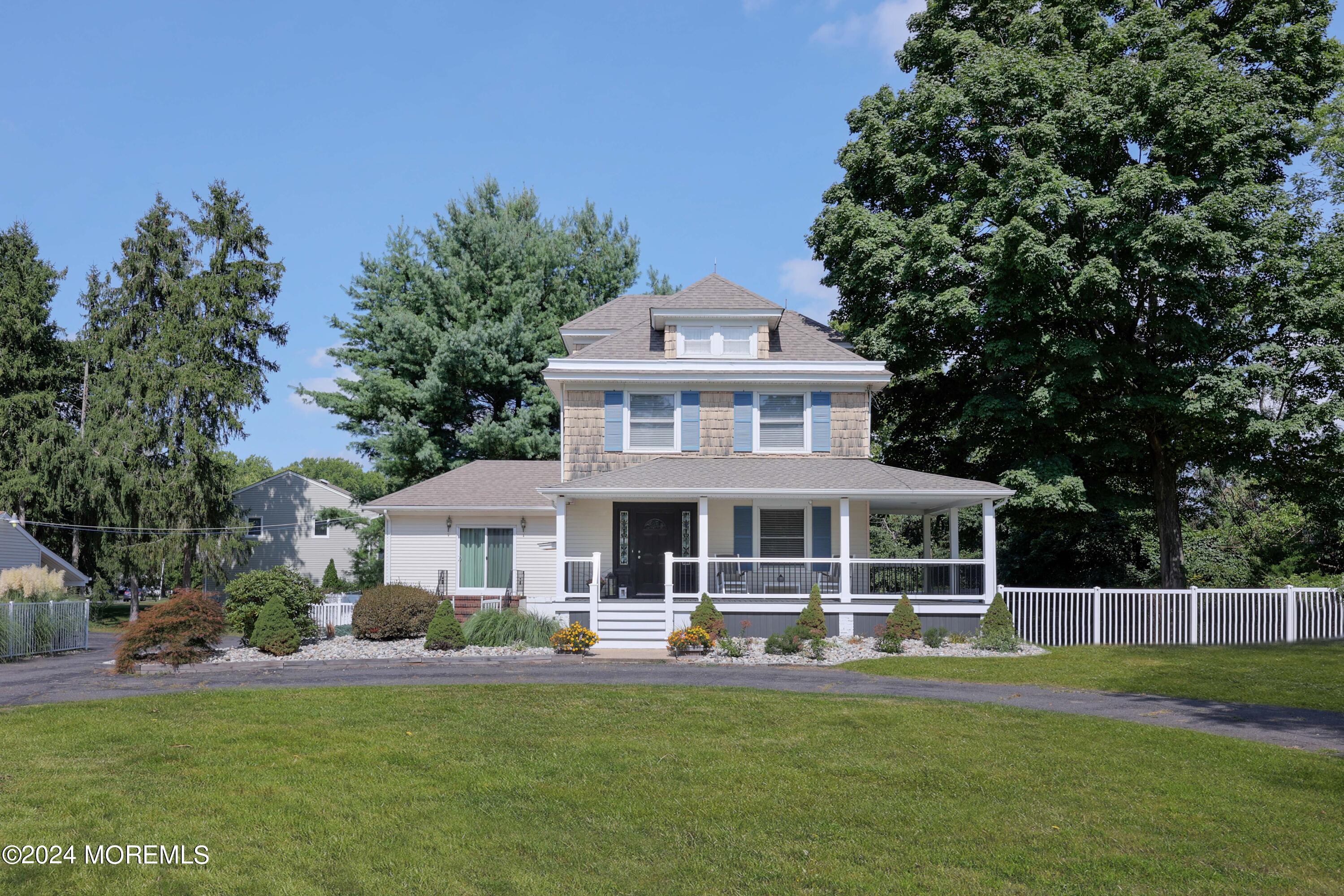 1158 West Front Street Lincroft, NJ 07738 - Photo 1 of 33 a front view of a house with a garden