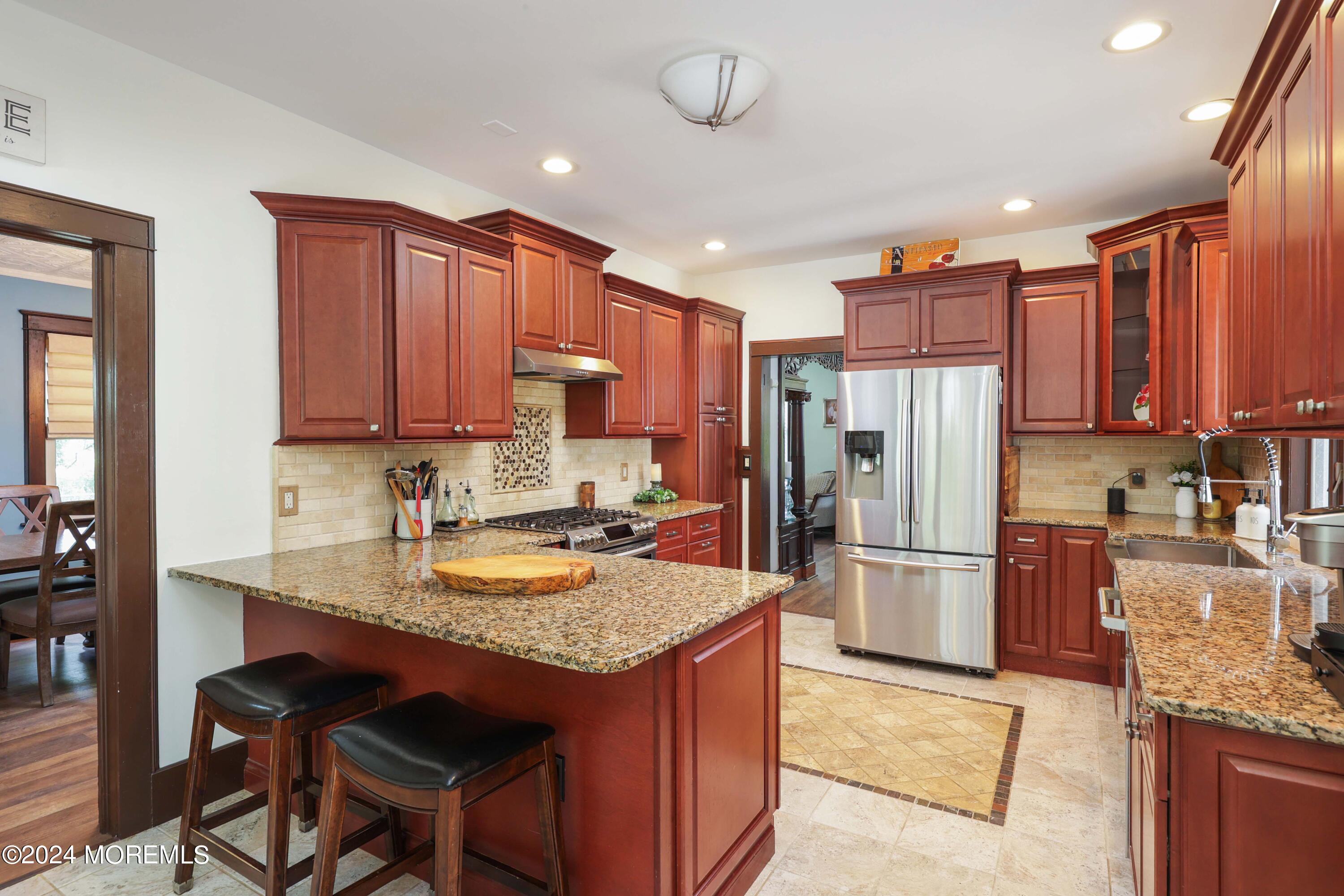 1158 West Front Street Lincroft, NJ 07738 - Photo 12 of 33 a kitchen with refrigerator cabinets and a sink