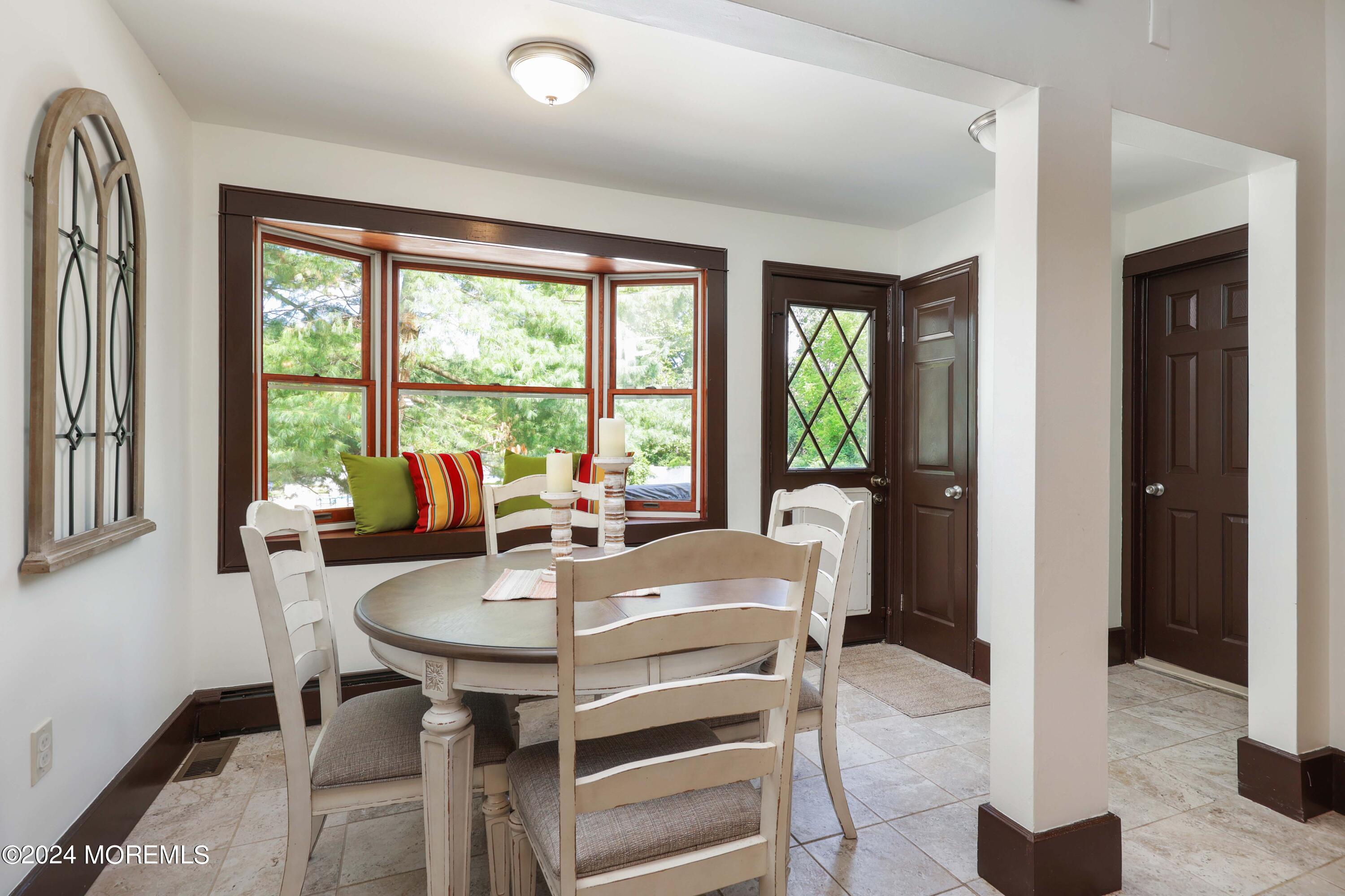 1158 West Front Street Lincroft, NJ 07738 - Photo 15 of 33 a view of a dining room with furniture window and outside view