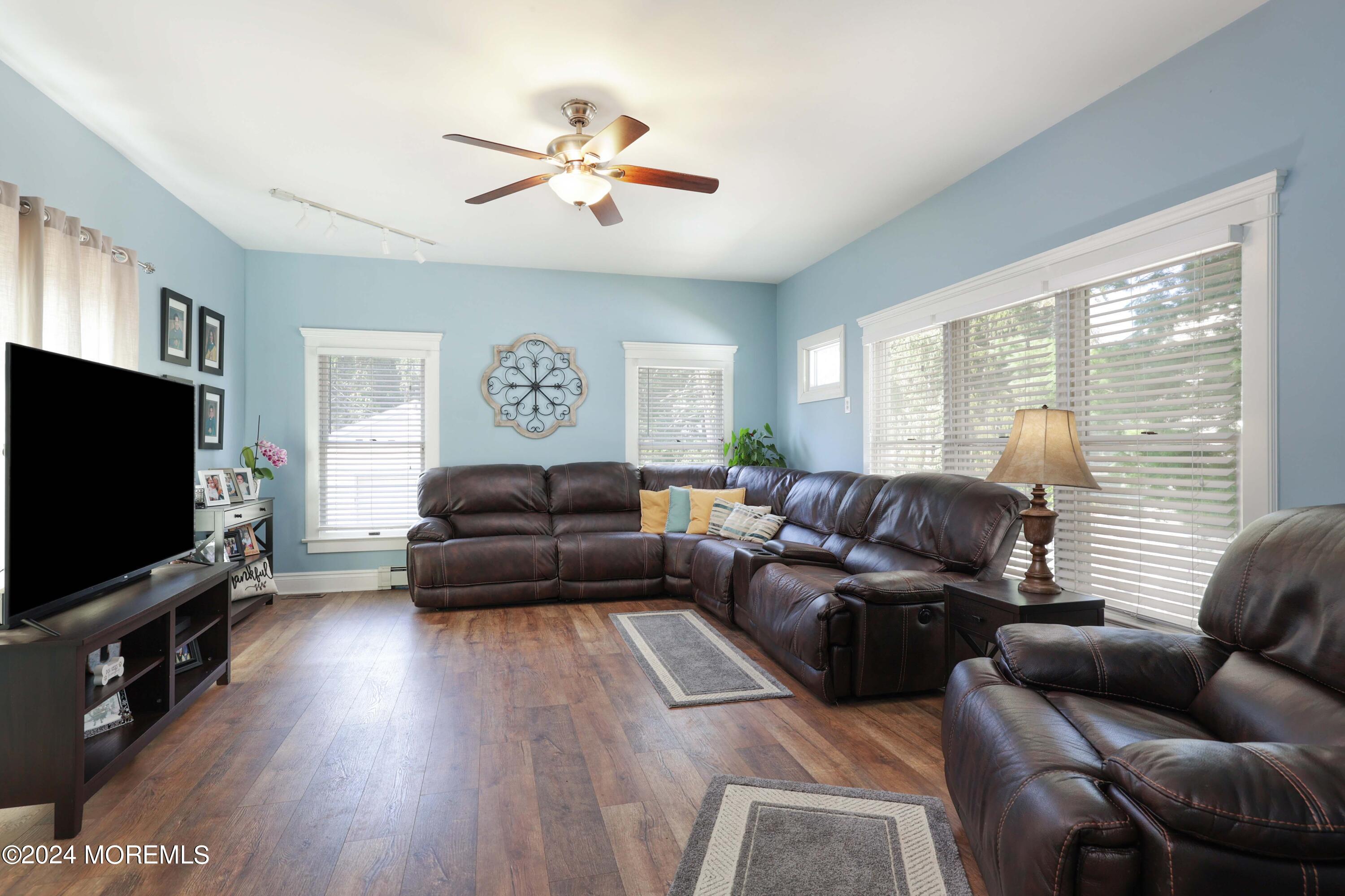 1158 West Front Street Lincroft, NJ 07738 - Photo 16 of 33 a living room with furniture and a flat screen tv