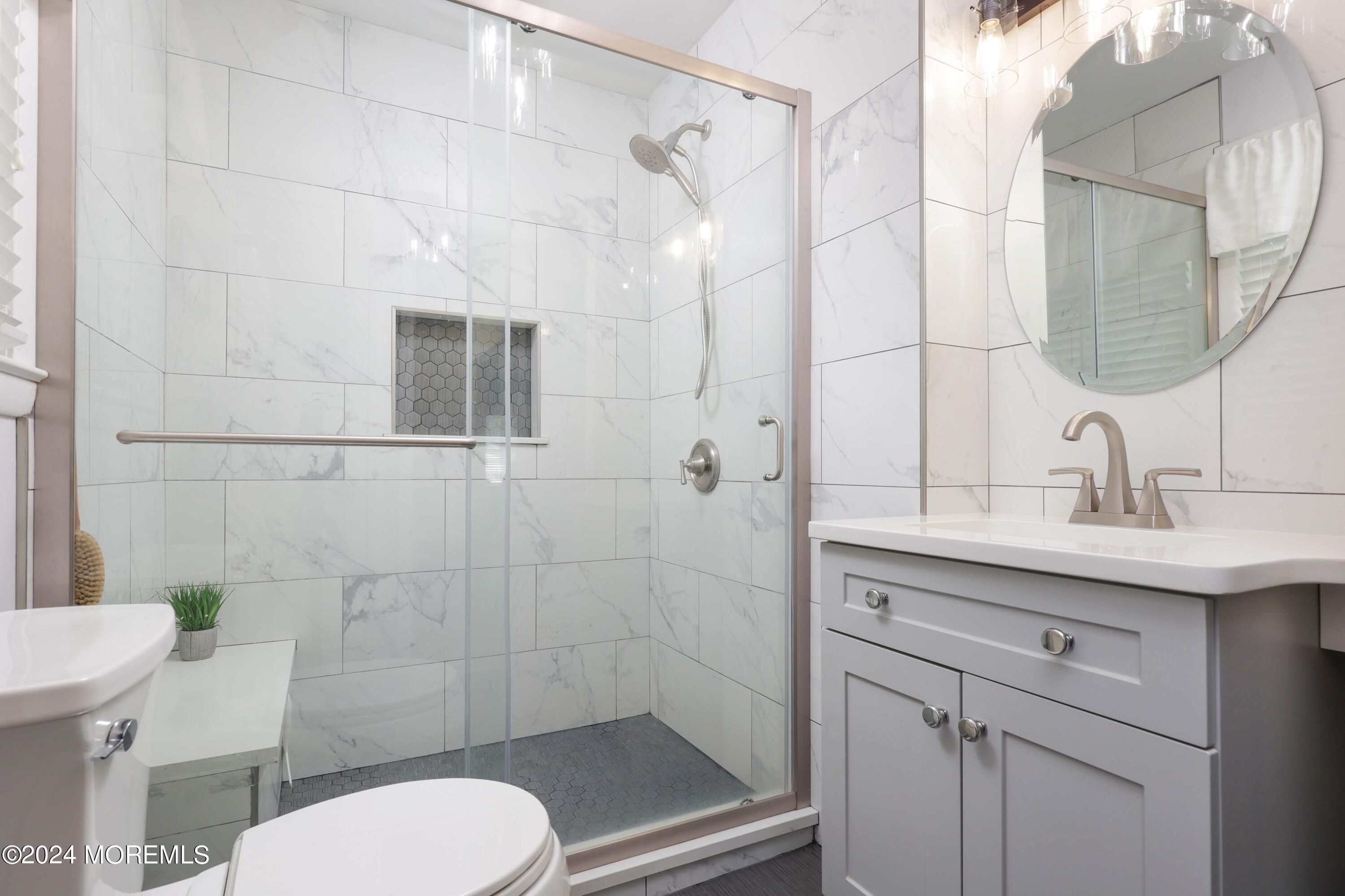 1158 West Front Street Lincroft, NJ 07738 - Photo 17 of 33 a bathroom with a sink a toilet and shower