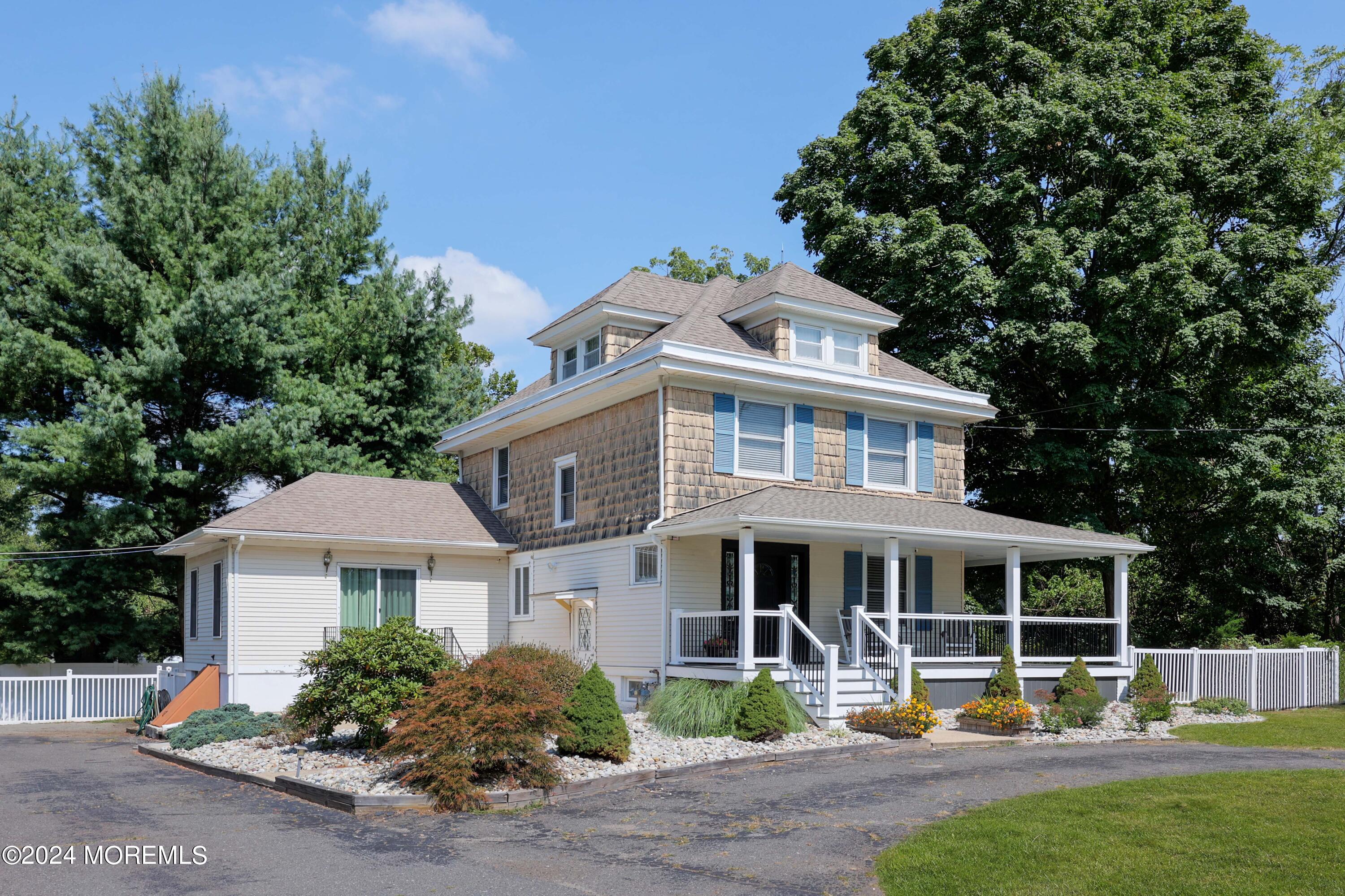 1158 West Front Street Lincroft, NJ 07738 - Photo 2 of 33 a front view of a house with garden