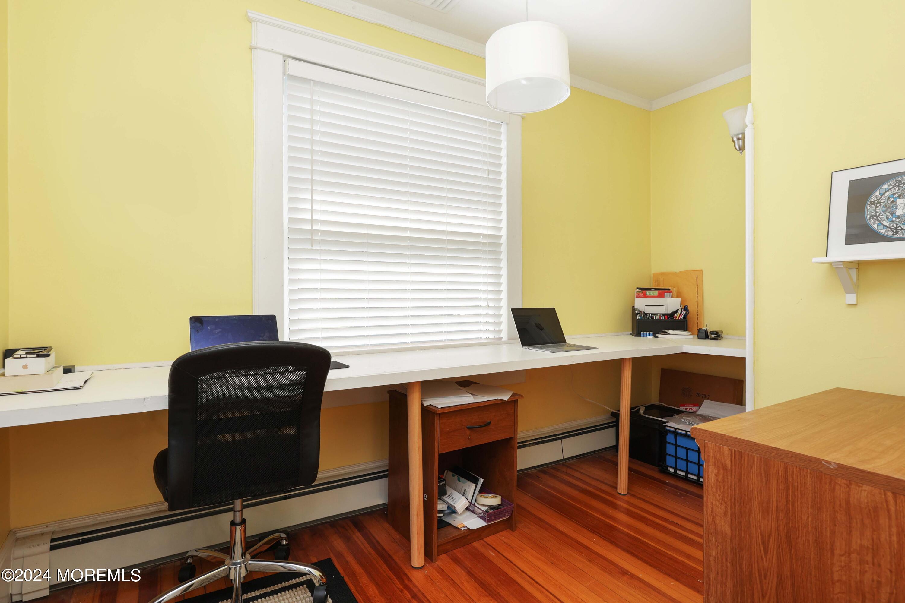 1158 West Front Street Lincroft, NJ 07738 - Photo 21 of 33 a work room with wooden floor and furniture