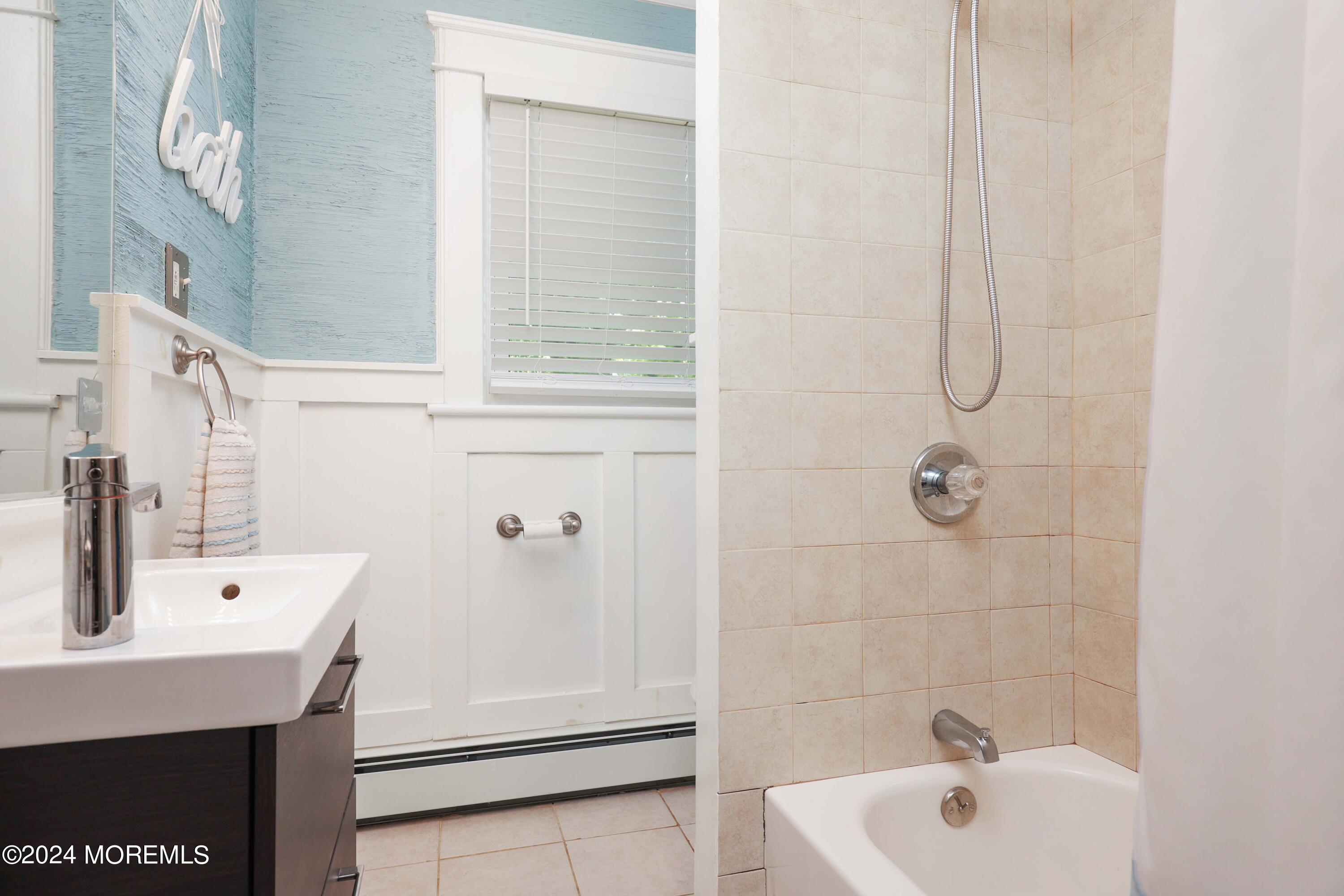 1158 West Front Street Lincroft, NJ 07738 - Photo 22 of 33 a bathroom with a sink and a bathtub