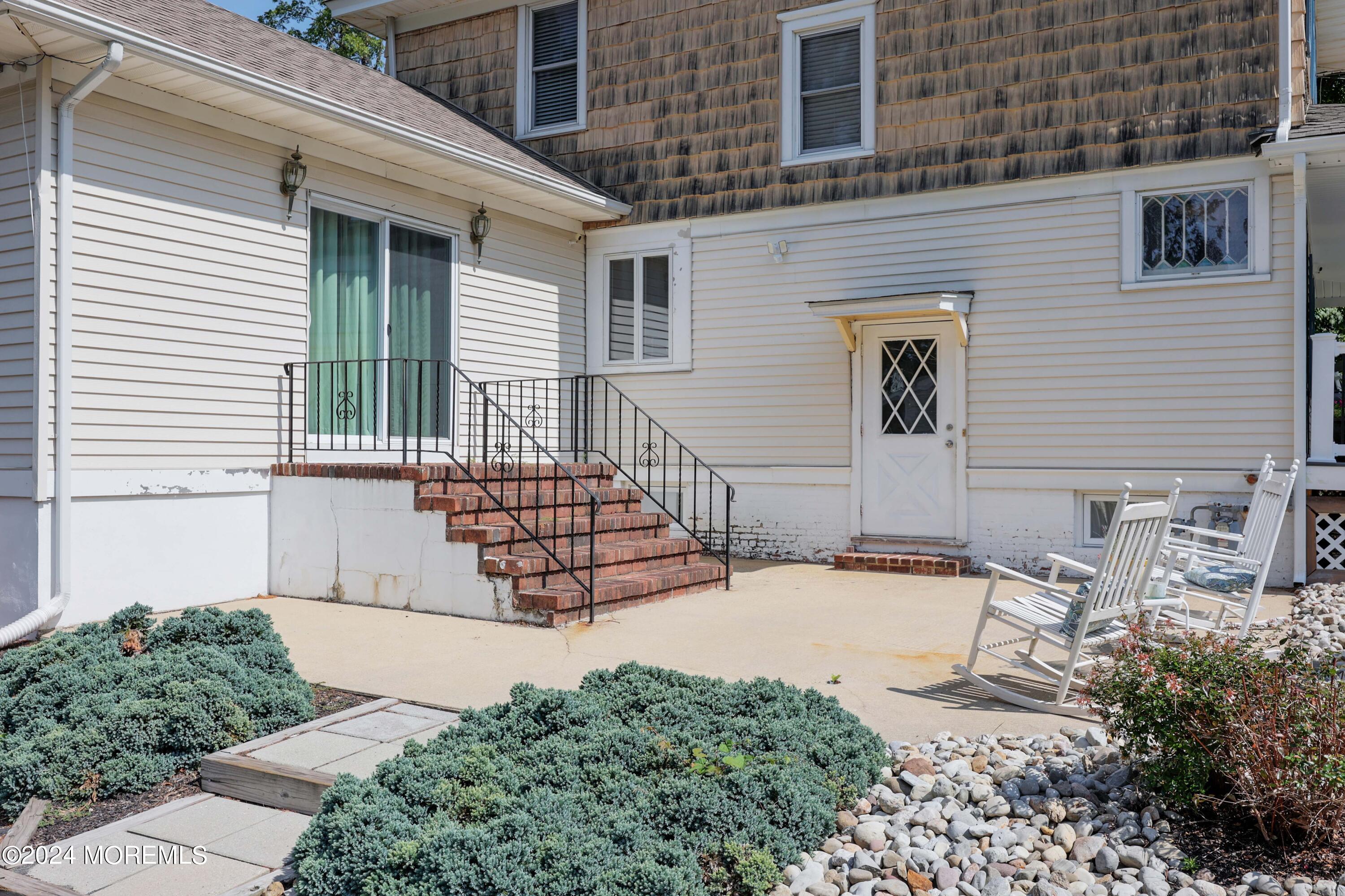 1158 West Front Street Lincroft, NJ 07738 - Photo 29 of 33 a backyard of a house with seating space