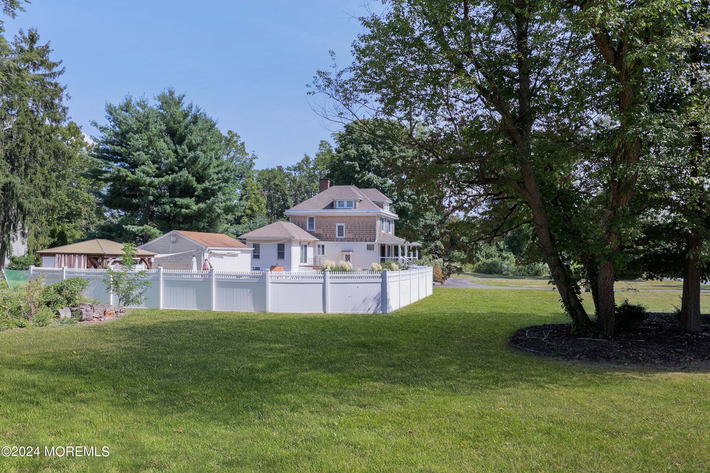 1158 West Front Street Lincroft, NJ 07738 - Photo 32 of 33 a front view of a house with a yard