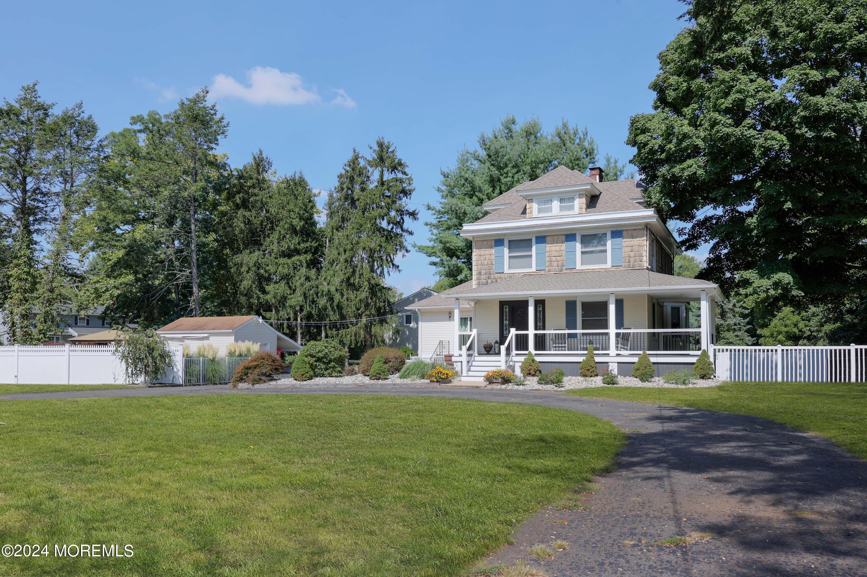 1158 West Front Street Lincroft, NJ 07738 - Photo 33 of 33 a front view of house with yard and trees in the background