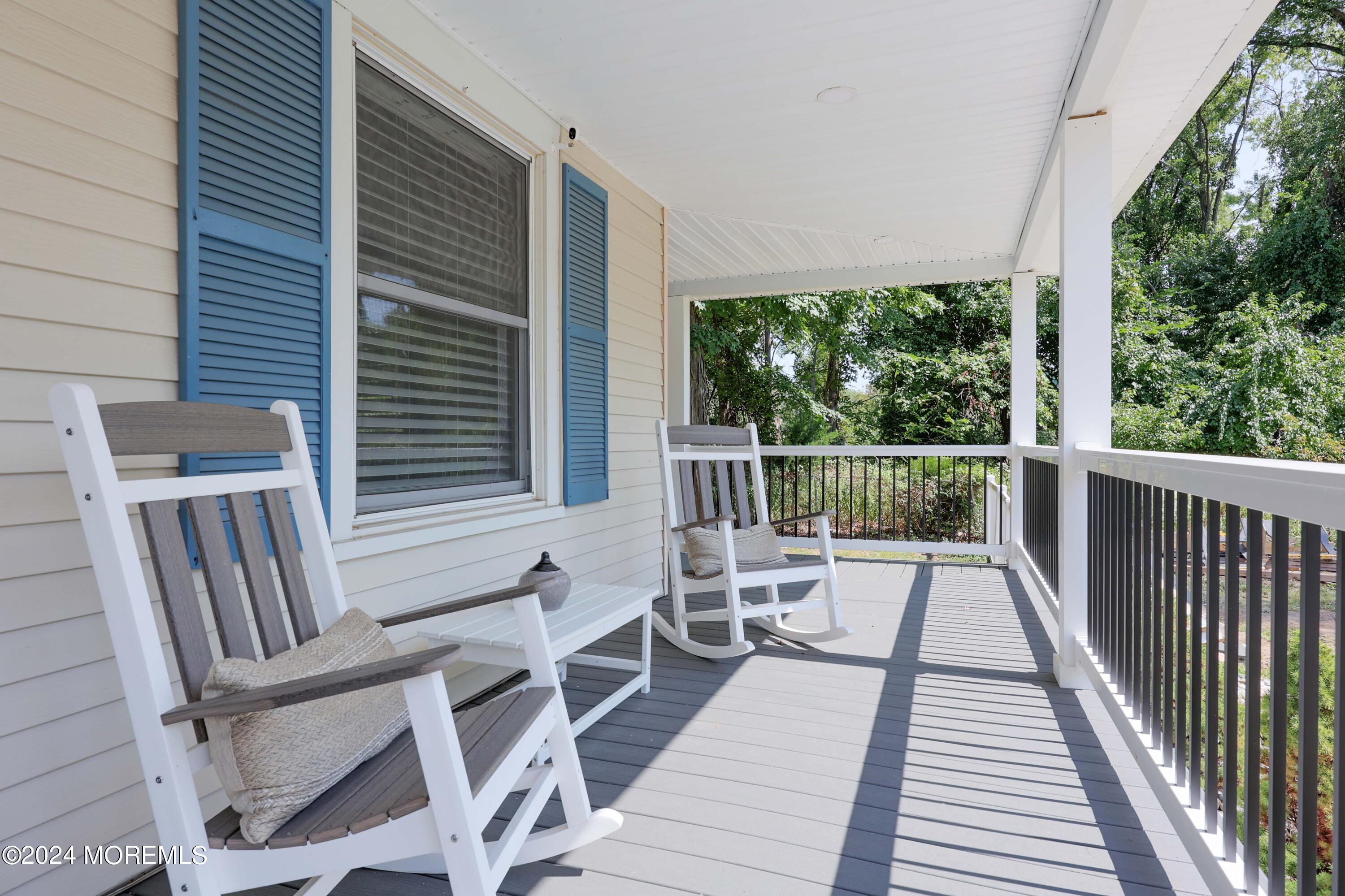 1158 West Front Street Lincroft, NJ 07738 - Photo 5 of 33 a view of balcony with wooden floor and outdoor seating