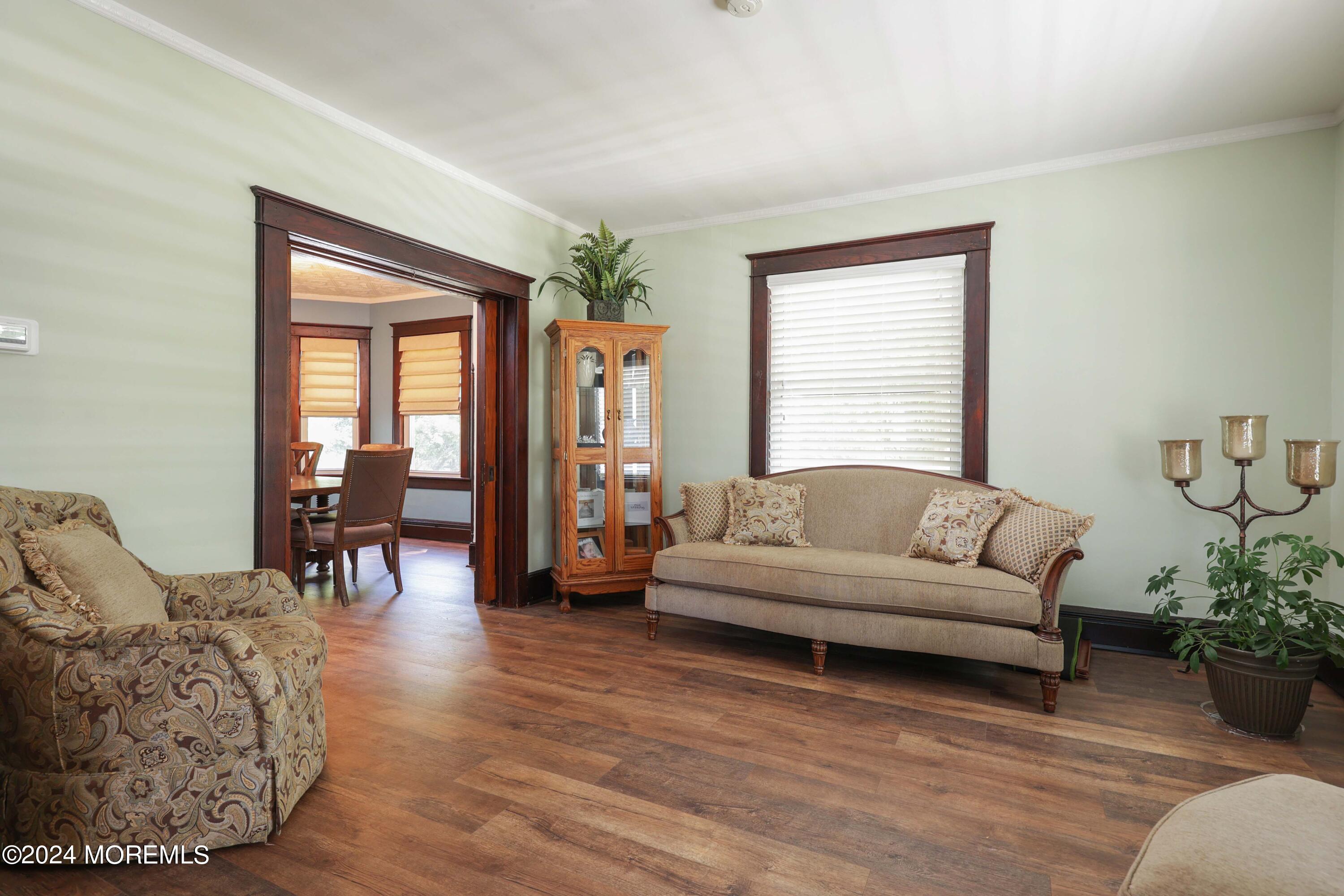 1158 West Front Street Lincroft, NJ 07738 - Photo 9 of 33 a living room with furniture and wooden floor