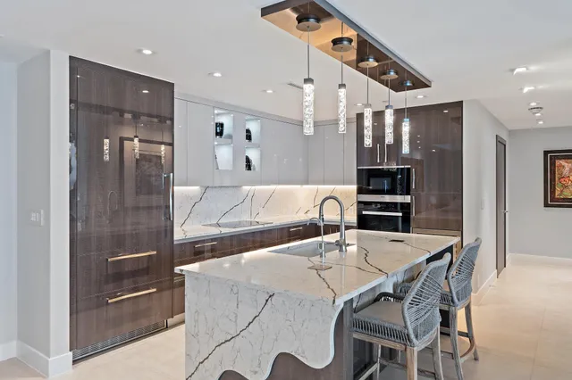 a living room with furniture a dining table and chairs with wooden floor