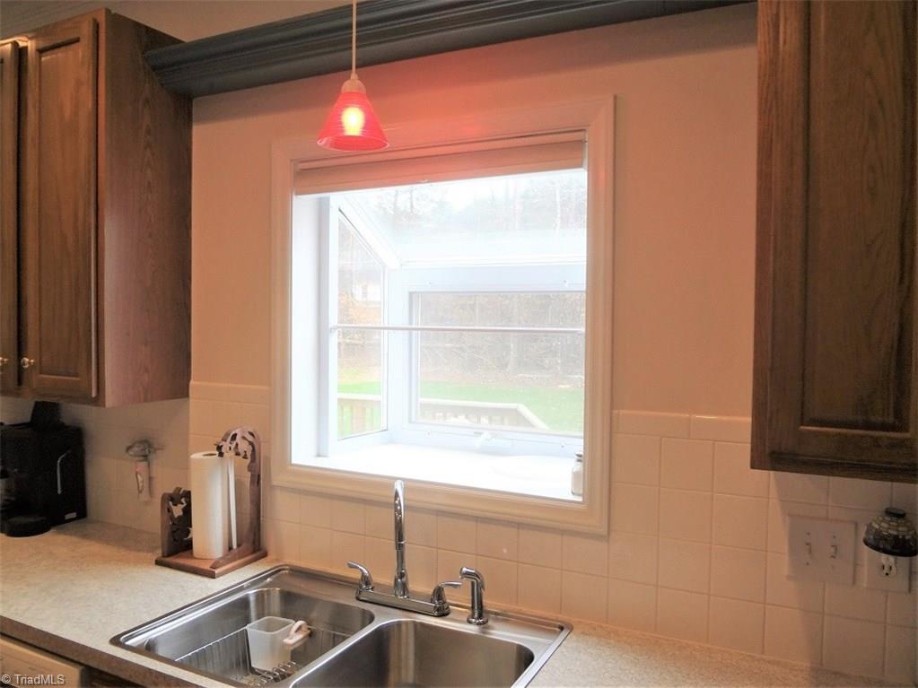 444 Rabbit Farm Trail Advance, NC 27006 - Photo 11 of 30 The Kitchen features a box window for plants.