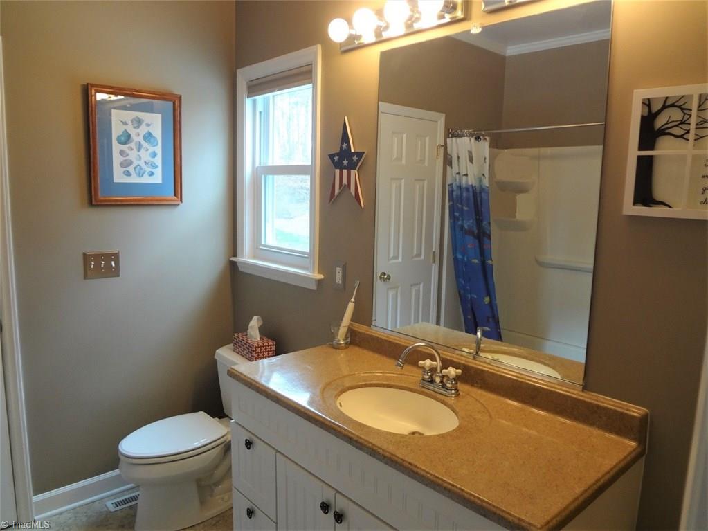 444 Rabbit Farm Trail Advance, NC 27006 - Photo 16 of 30 The Master Bath has a solid surface counter on the vanity.