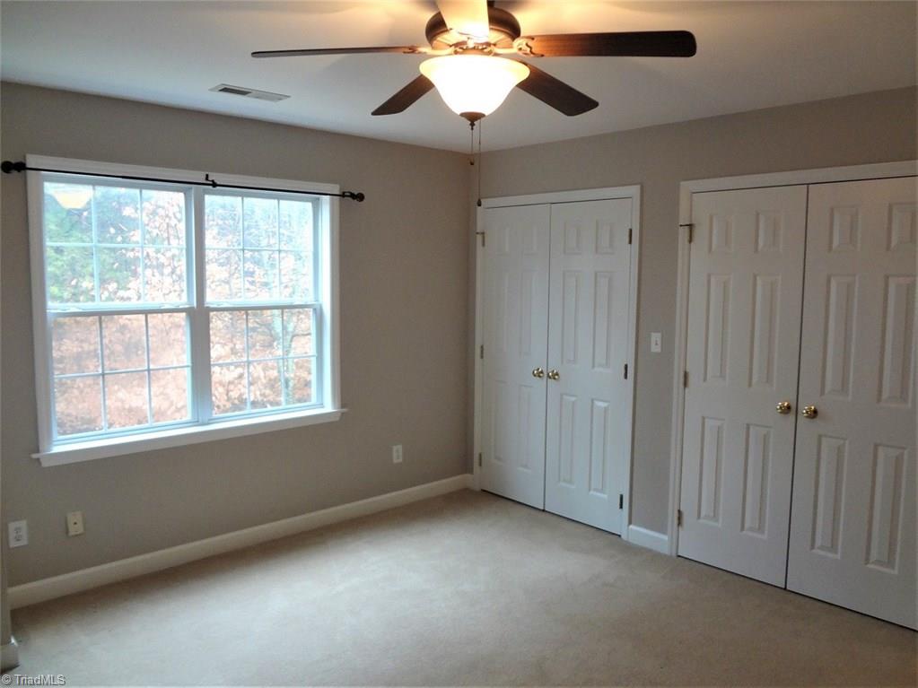 444 Rabbit Farm Trail Advance, NC 27006 - Photo 22 of 30 This bedroom has a new ceiling fan and double closets.