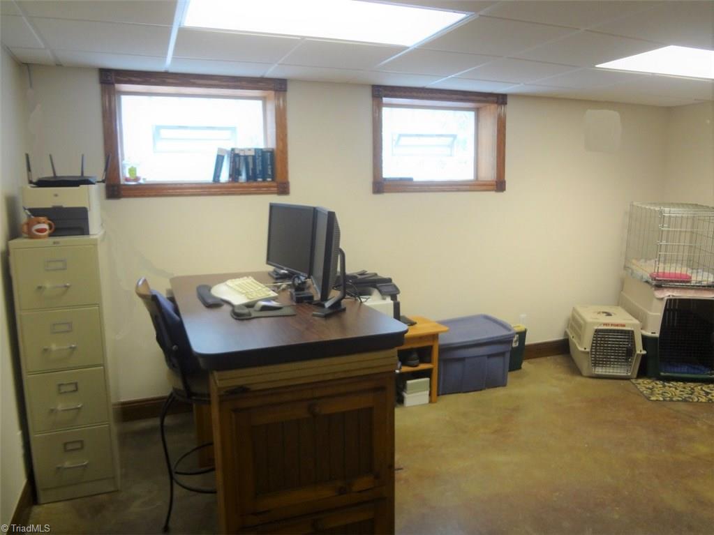 444 Rabbit Farm Trail Advance, NC 27006 - Photo 24 of 30 This basement space could be used as an office, rec room, or workshop.
