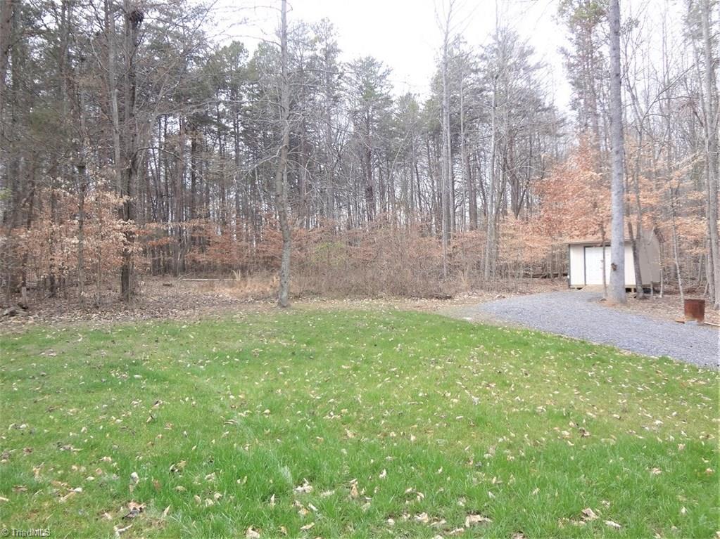 444 Rabbit Farm Trail Advance, NC 27006 - Photo 28 of 30 There are a couple of storage buildings in the back, as well as plenty of mature trees.