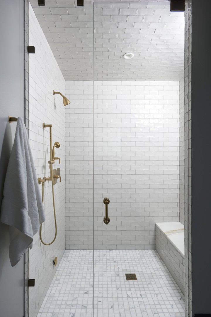 1109 West Washington Boulevard, Unit 5D Chicago, IL 60607 - Photo 17 of 21 a bathroom with a glass shower door