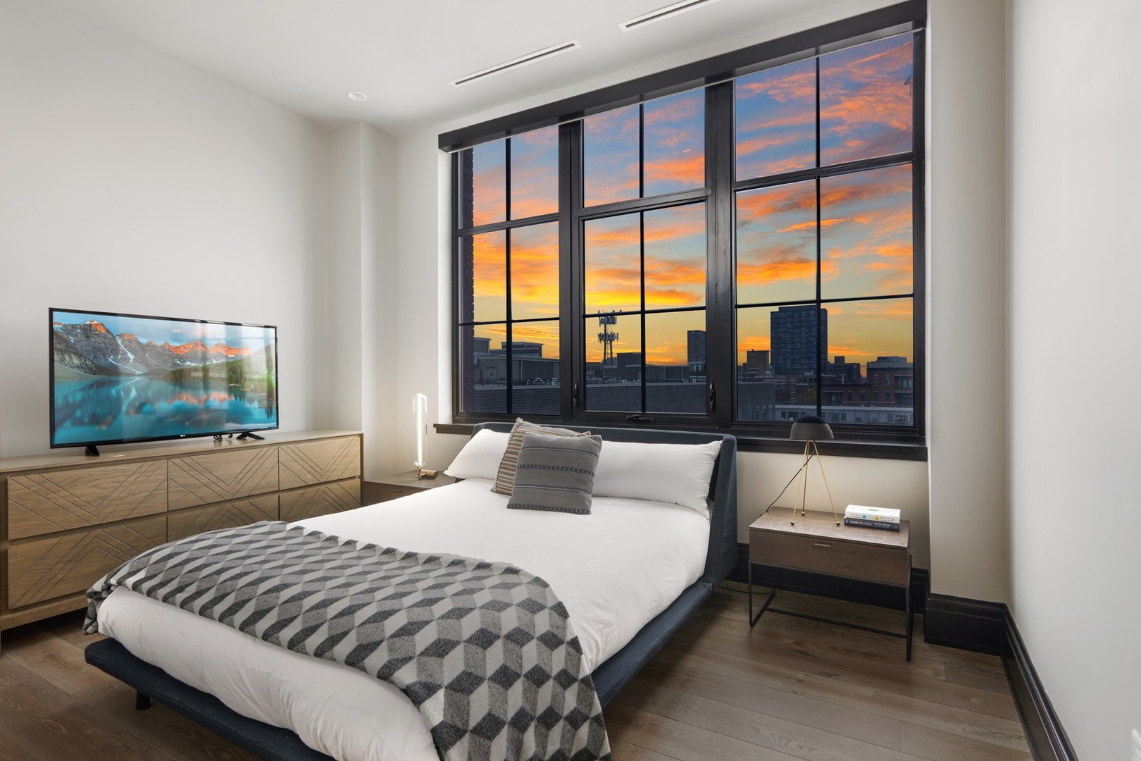 1109 West Washington Boulevard, Unit 5D Chicago, IL 60607 - Photo 18 of 21 a bedroom with a bed and a large window