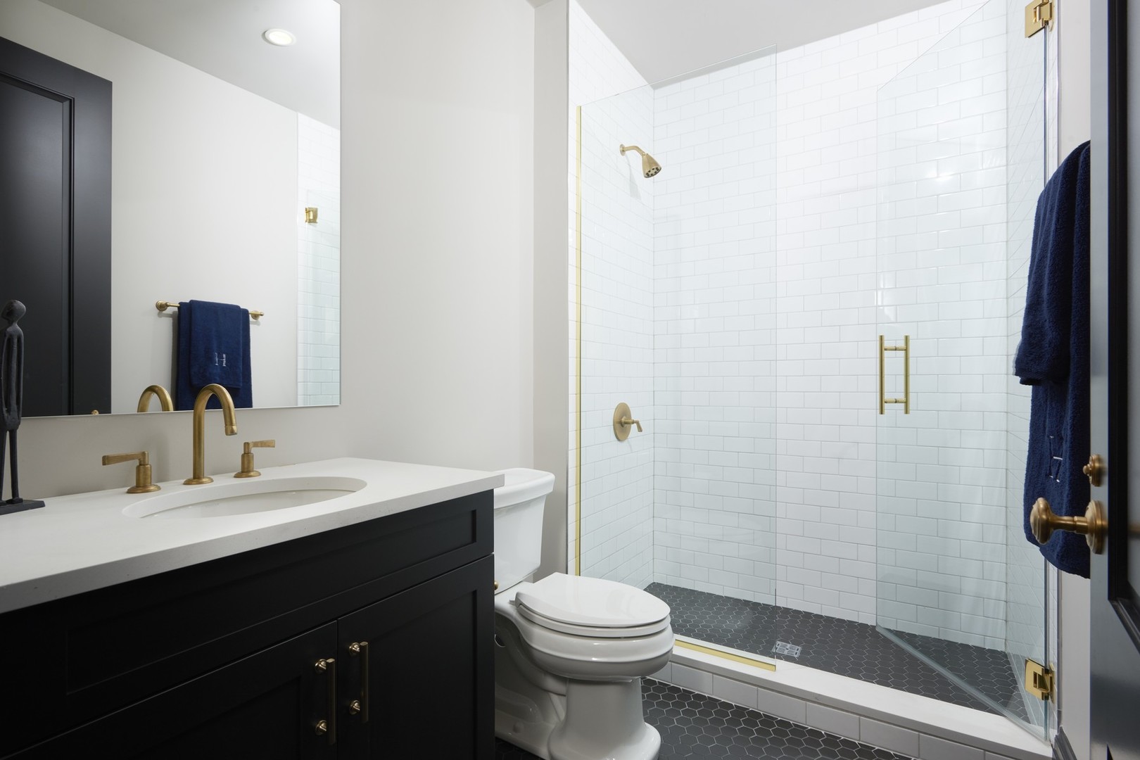 1109 West Washington Boulevard, Unit 5D Chicago, IL 60607 - Photo 19 of 21 a bathroom with a sink a toilet and shower