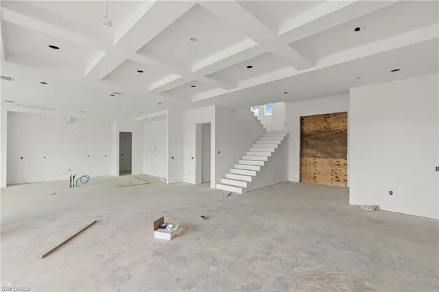 a view of a hallway with seating space