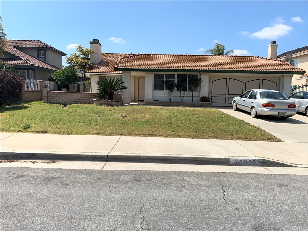 20033 Sweetbay Road Riverside, CA 92508 - Photo 1 of 1 a front view of a house with a yard
