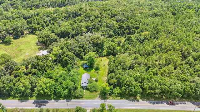 a view of a yard with an outdoor space