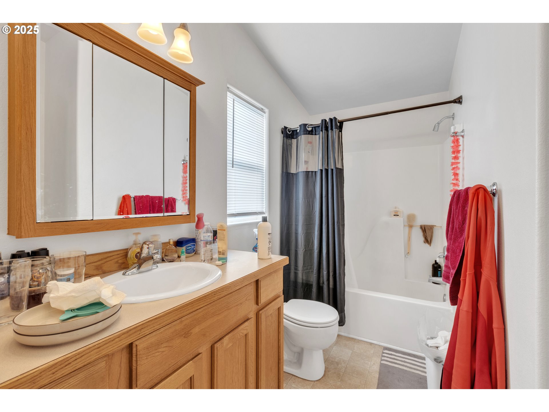 3397 Oak Street Florence, OR 97439 - Photo 17 of 48 a bathroom with a sink toilet and shower