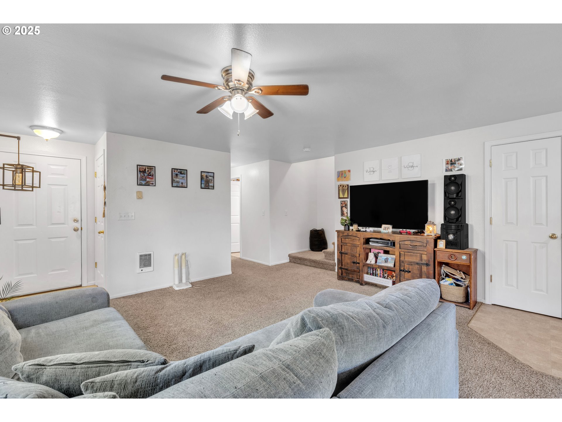 3397 Oak Street Florence, OR 97439 - Photo 29 of 48 a living room with furniture and a flat screen tv