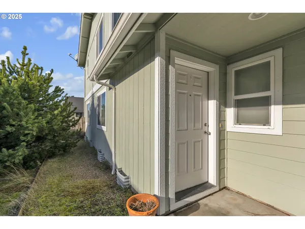 a view of a door and a window