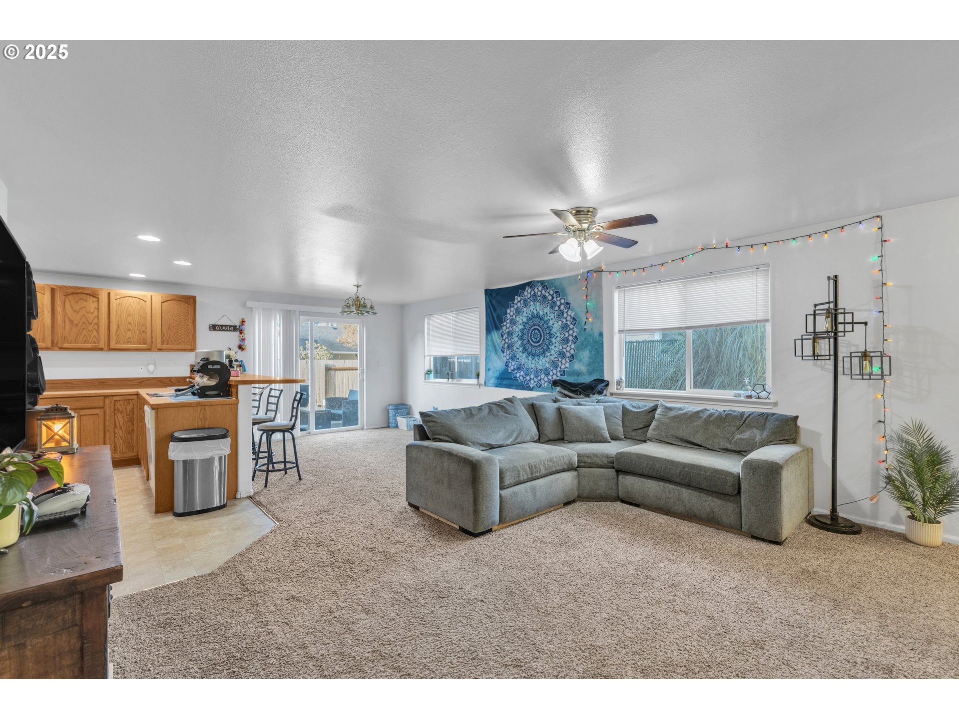 3397 Oak Street Florence, OR 97439 - Photo 31 of 48 a living room with furniture and a large window
