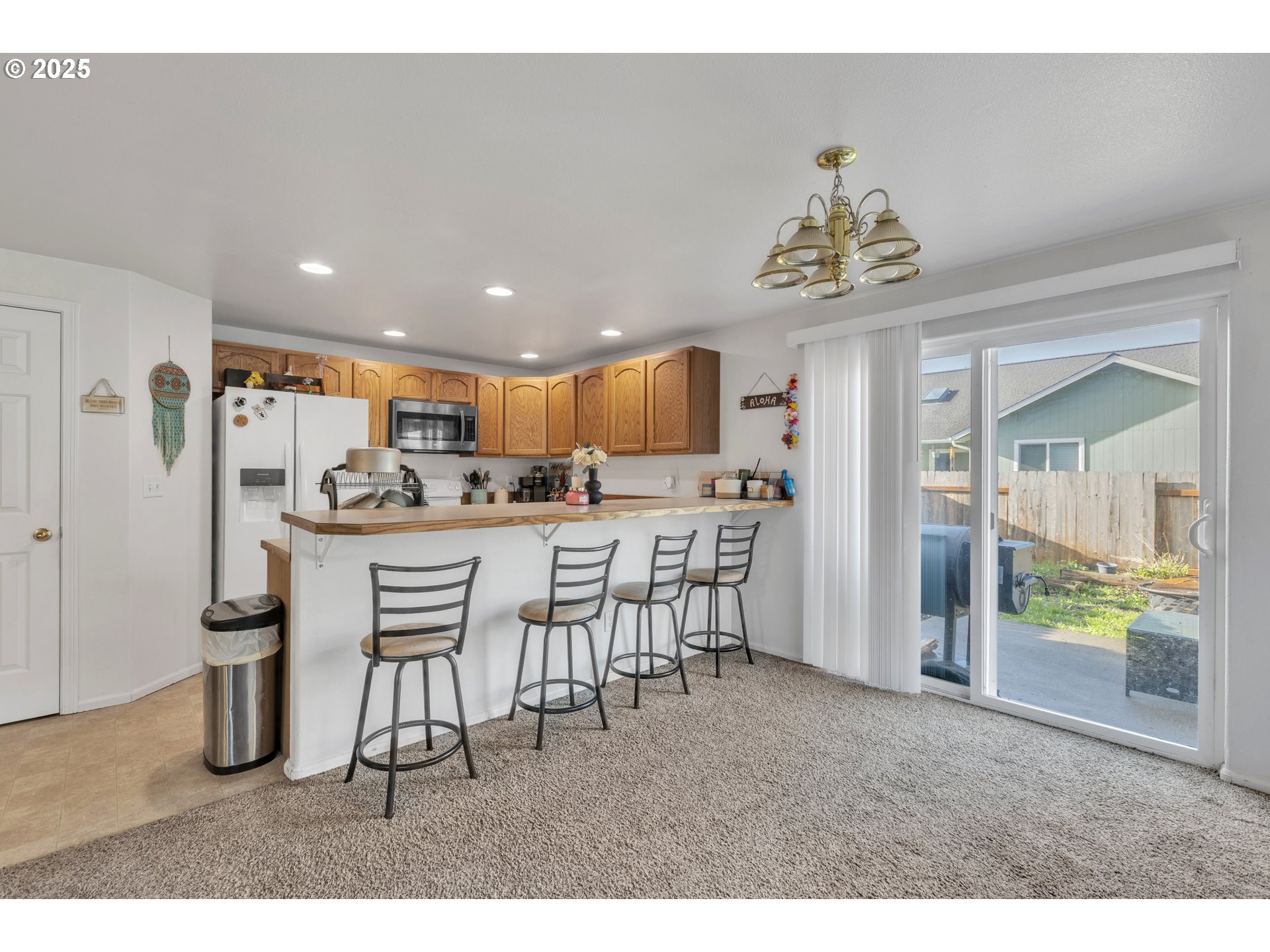 3397 Oak Street Florence, OR 97439 - Photo 32 of 48 a view of a dining room with furniture