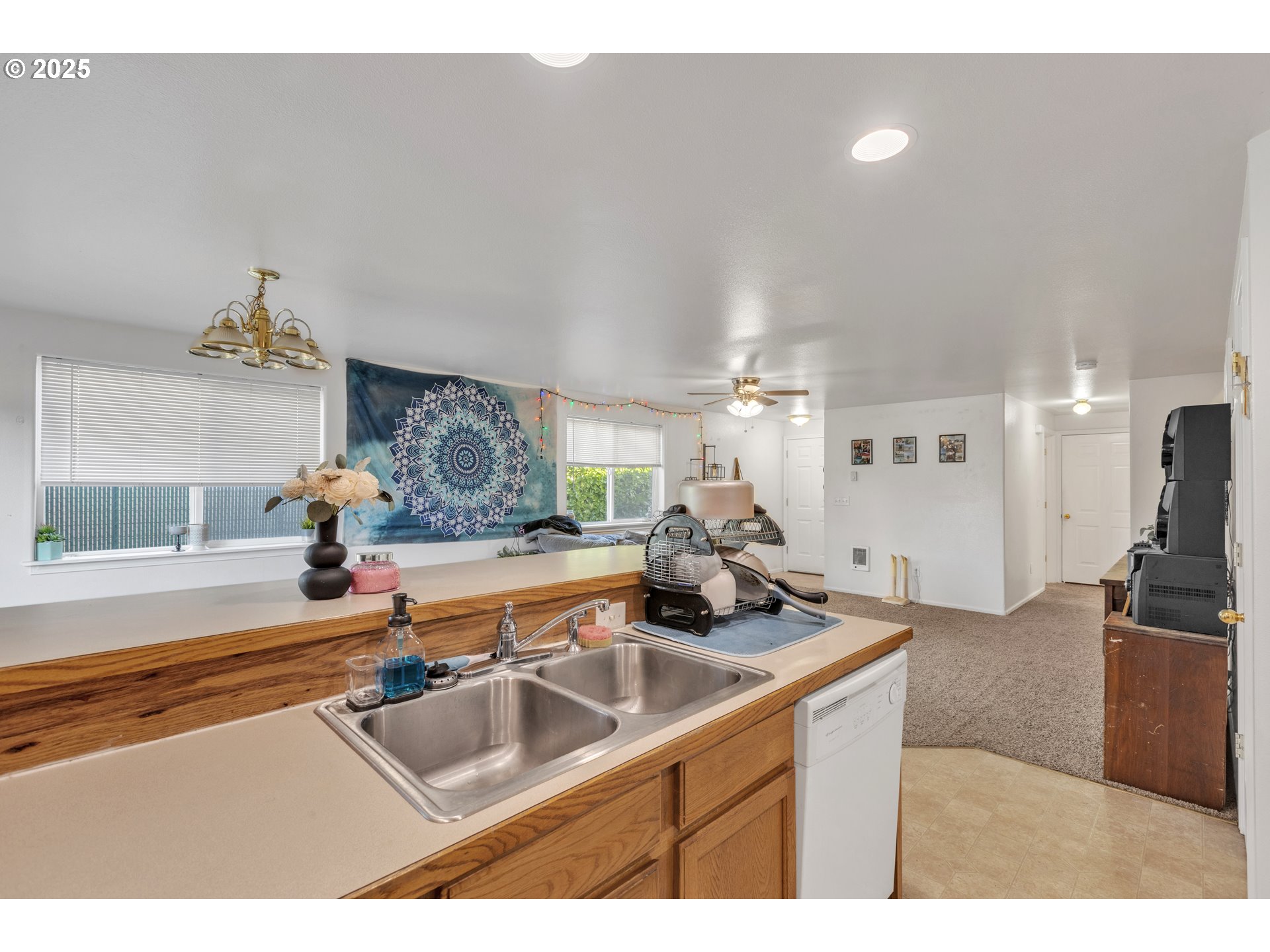 3397 Oak Street Florence, OR 97439 - Photo 35 of 48 a kitchen with stainless steel appliances granite countertop a sink and a refrigerator