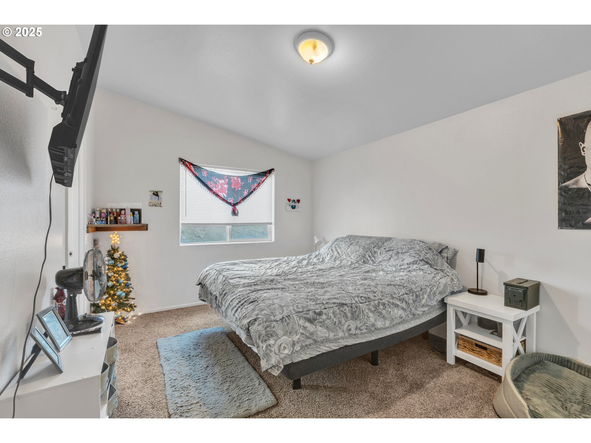 3397 Oak Street Florence, OR 97439 - Photo 37 of 48 a bedroom with a bed and a dresser in it